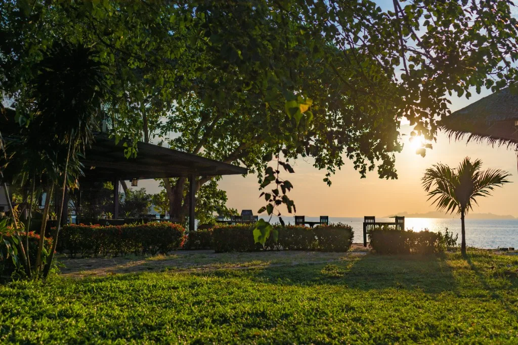 Satva Samui hotel grounds by the sea at sunset