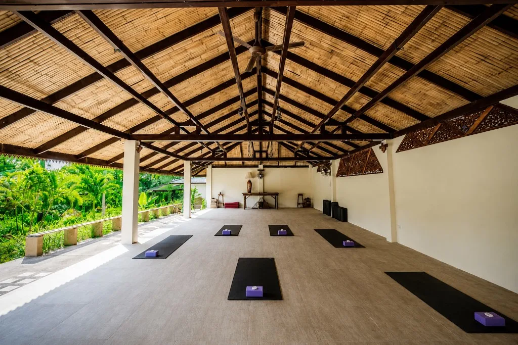 Garden yoga pavilion — open-air studio overlooking tropical greenery