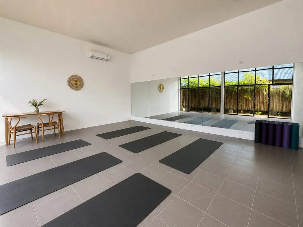Indoor yoga studio with air conditioning and mirrors — Satva Samui